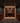 Wine cellar with wooden shelves and bottles, dimly lit.